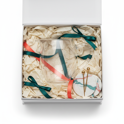 Clear glass water pitcher arranged in an elegant gift box with teal and coral ribbons