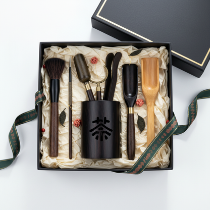 Black tea ceremony utensil holder and coordinated tools presented in an elegant gift box