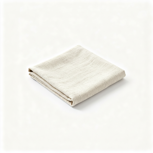 Folded natural ivory linen tea towel on a clean white background